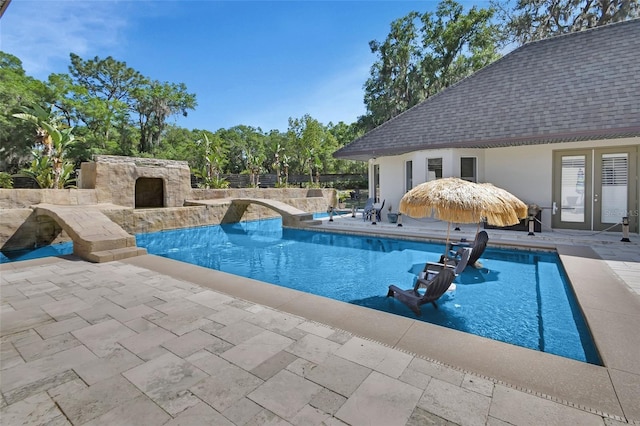 view of pool featuring a patio