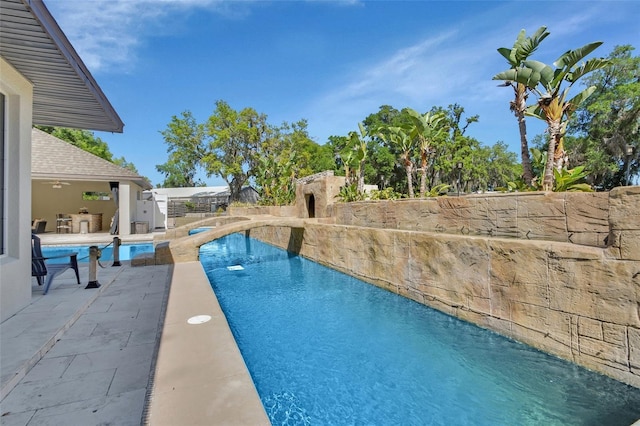 view of pool with a patio area and a fenced backyard