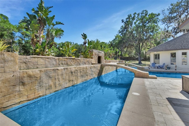swimming pool featuring a patio area