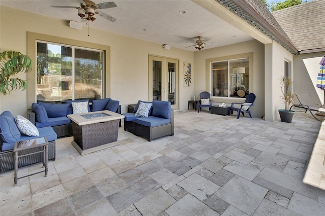 view of patio featuring an outdoor living space with a fire pit and ceiling fan
