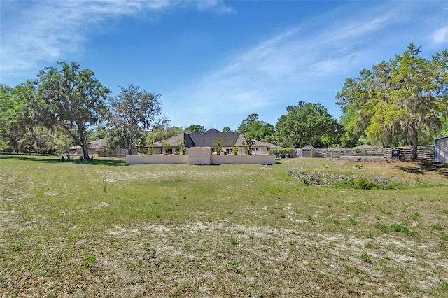 view of yard with a storage shed and an outdoor structure
