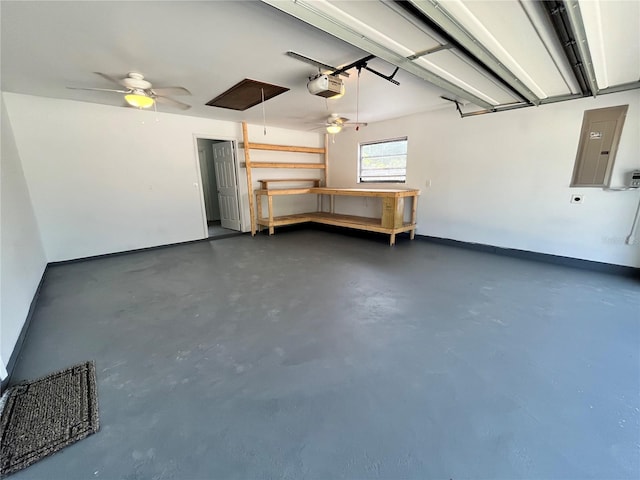 garage with a garage door opener, a ceiling fan, electric panel, and baseboards