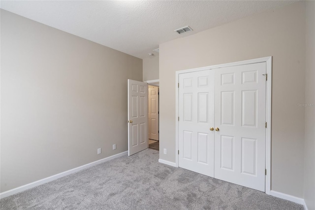 417 Victoria Hills Dr, Deland, FL 32724 - unfurnished bedroom with carpet floors, a closet, baseboards, and a textured ceiling