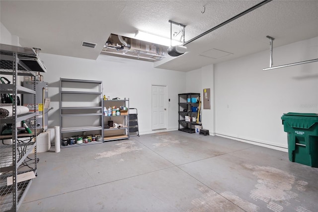 417 Victoria Hills Dr, Deland, FL 32724 - garage featuring water heater, electric panel, and a garage door opener