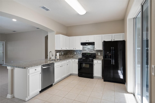 417 Victoria Hills Dr, Deland, FL 32724 - kitchen with black appliances, a sink, extractor fan, a peninsula, and light tile patterned flooring