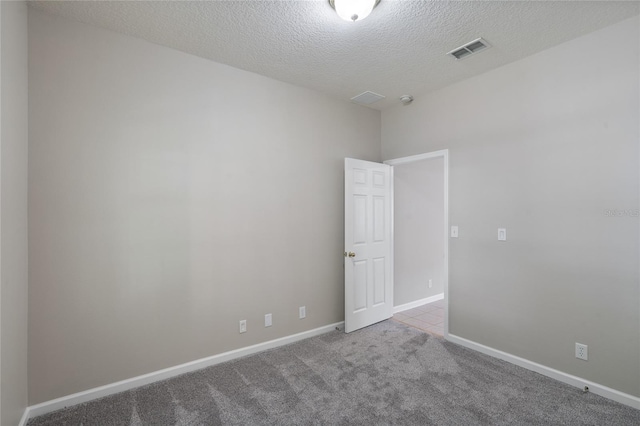 417 Victoria Hills Dr, Deland, FL 32724 - spare room with carpet floors, a textured ceiling, and baseboards