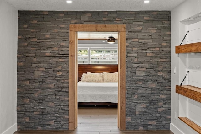 interior space featuring wood finished floors and recessed lighting