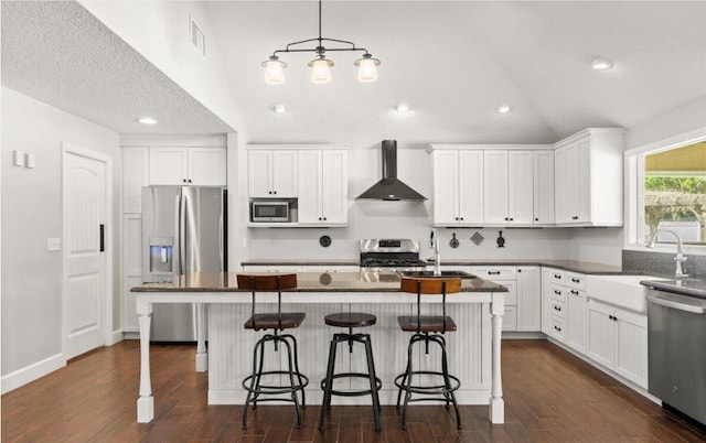 28 Shadowcreek Way, Ormond Beach, FL 32174 - kitchen with wall chimney range hood, white cabinets, appliances with stainless steel finishes, and a sink