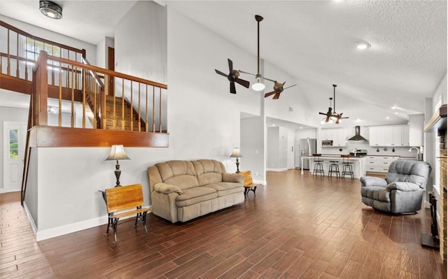 28 Shadowcreek Way, Ormond Beach, FL 32174 - living room with baseboards, ceiling fan, high vaulted ceiling, and dark wood-type flooring