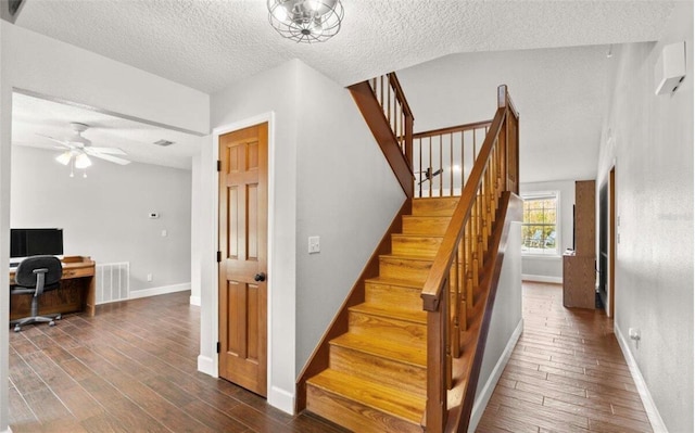 28 Shadowcreek Way, Ormond Beach, FL 32174 - stairway with visible vents, baseboards, a textured ceiling, and wood finished floors