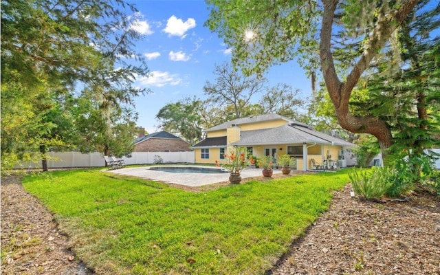 28 Shadowcreek Way, Ormond Beach, FL 32174 - back of house featuring a fenced backyard, a fenced in pool, a yard, and a patio area