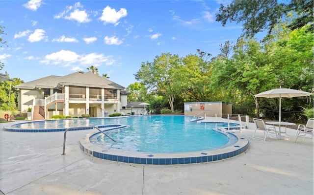 28 Shadowcreek Way, Ormond Beach, FL 32174 - community pool featuring a patio area and stairway