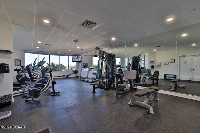 exercise room featuring visible vents and a drop ceiling