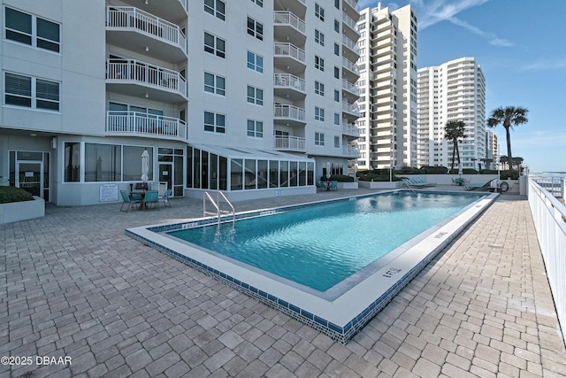 community pool featuring a patio area