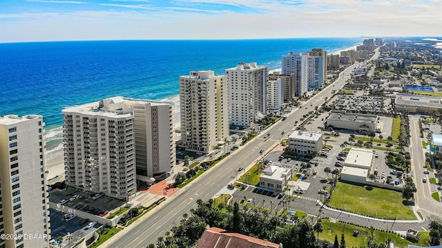 birds eye view of property featuring a view of city and a water view