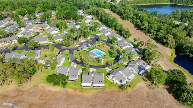 birds eye view of property featuring a residential view and a water view