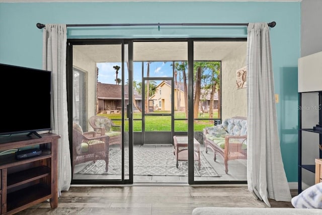 doorway to outside featuring wood finished floors