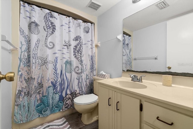 full bathroom with a shower with curtain, visible vents, toilet, wood finished floors, and vanity