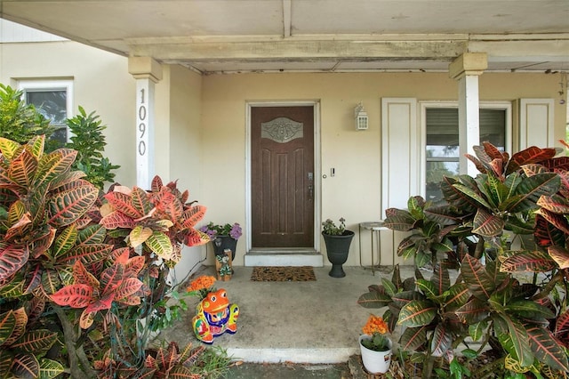 property entrance featuring covered porch