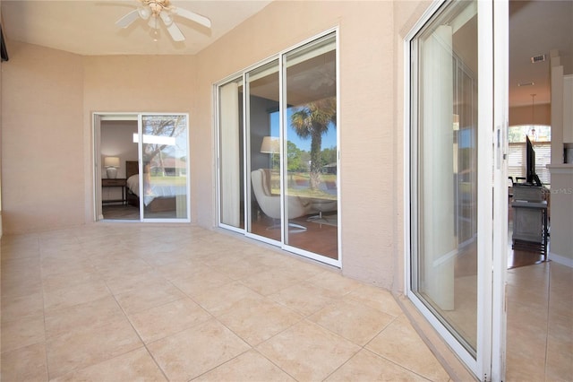balcony featuring visible vents, a ceiling fan, and a patio