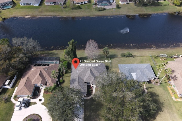bird's eye view with a water view and a residential view