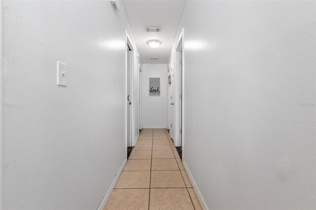 1343 Rocky Rd, Kissimmee, FL 34744 - hall featuring baseboards, visible vents, and light tile patterned floors