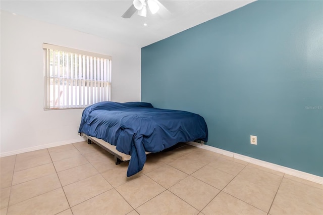 1343 Rocky Rd, Kissimmee, FL 34744 - bedroom featuring light tile patterned flooring, ceiling fan, and baseboards