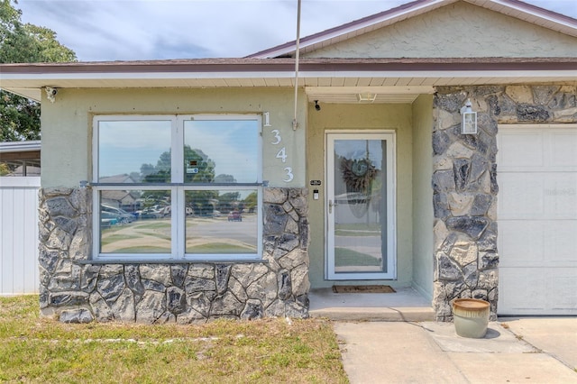 1343 Rocky Rd, Kissimmee, FL 34744 - view of exterior entry featuring stucco siding and stone siding