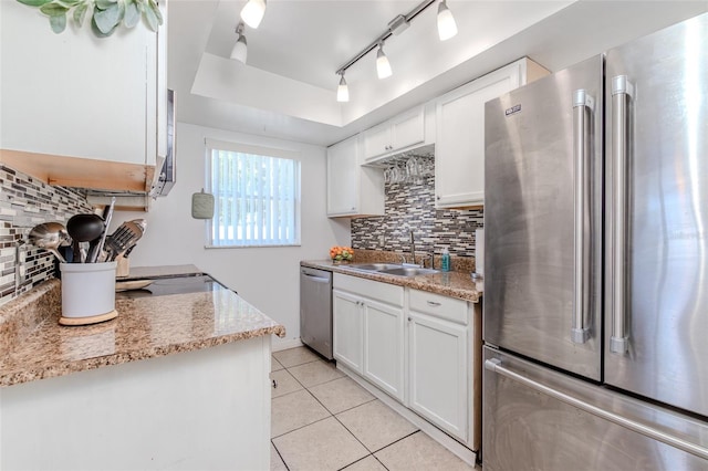 1343 Rocky Rd, Kissimmee, FL 34744 - kitchen with light tile patterned floors, a sink, stainless steel appliances, and decorative backsplash