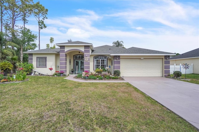 view of front of home featuring a front lawn, driveway, stucco siding, and a garage