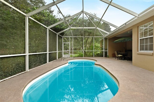 8231 SW 79th Ct, Ocala, FL 34476 - outdoor pool featuring glass enclosure and a patio area