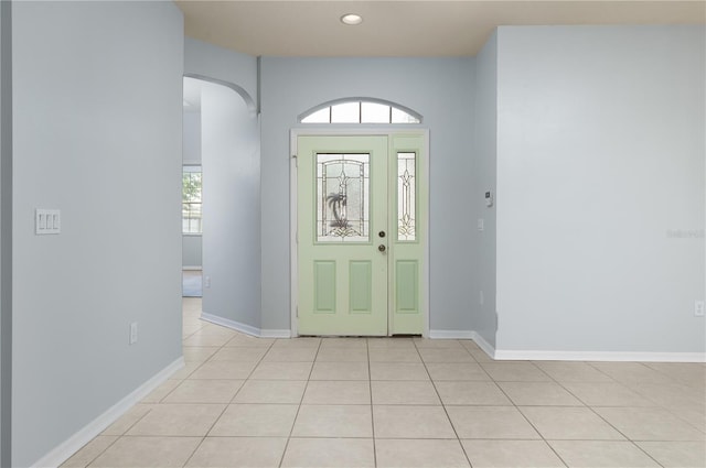 8231 SW 79th Ct, Ocala, FL 34476 - foyer featuring light tile patterned floors, recessed lighting, arched walkways, and baseboards