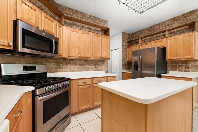 8231 SW 79th Ct, Ocala, FL 34476 - kitchen featuring light tile patterned floors, light countertops, stainless steel appliances, and tasteful backsplash