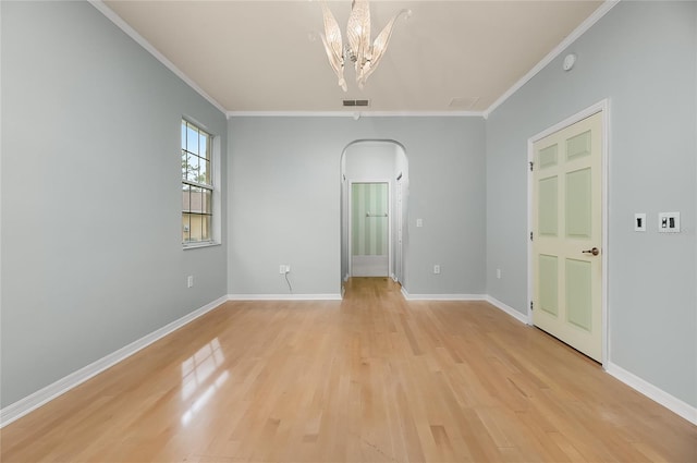 8231 SW 79th Ct, Ocala, FL 34476 - unfurnished room featuring crown molding, arched walkways, visible vents, and light wood-type flooring