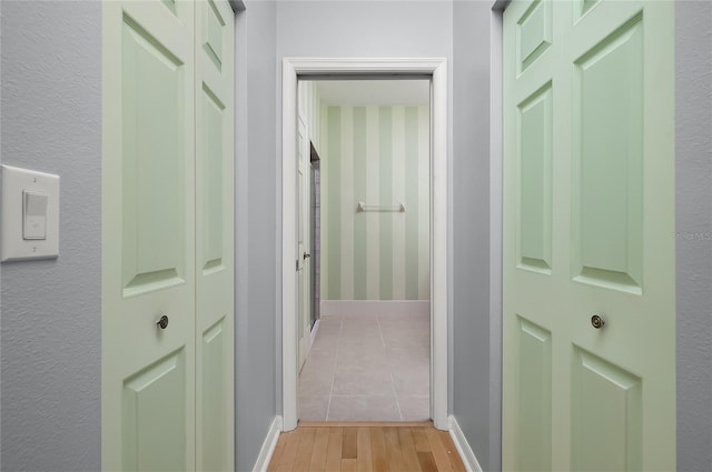 8231 SW 79th Ct, Ocala, FL 34476 - hallway featuring light wood-type flooring and baseboards