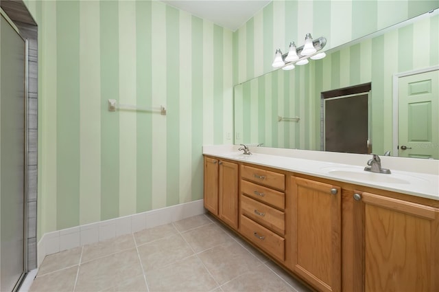 8231 SW 79th Ct, Ocala, FL 34476 - bathroom featuring tile patterned floors, double vanity, a stall shower, and a sink