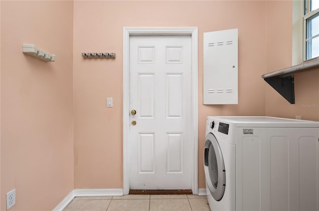 8231 SW 79th Ct, Ocala, FL 34476 - washroom featuring light tile patterned flooring, laundry area, washer / dryer, and baseboards