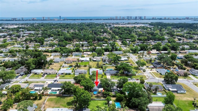 birds eye view of property with a residential view, a city view, and a water view
