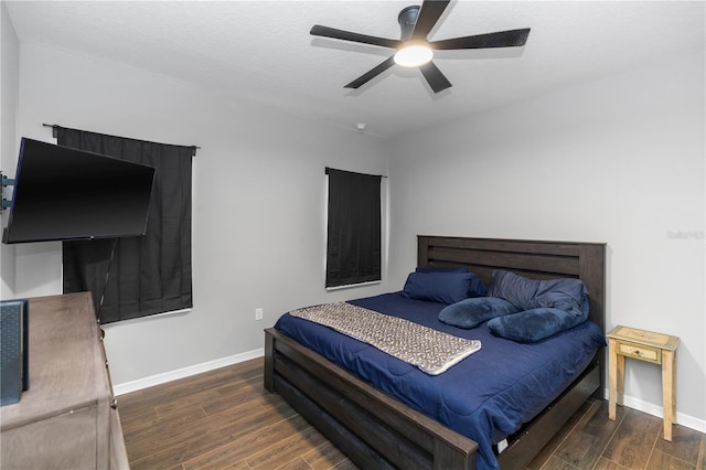 bedroom with baseboards, a ceiling fan, and wood finished floors