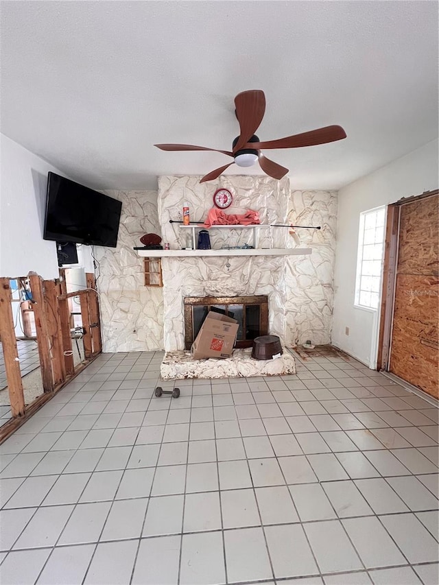 855 Boca Ciega Isle Dr, St Pete Beach, FL 33706 - unfurnished living room with a fireplace and a ceiling fan