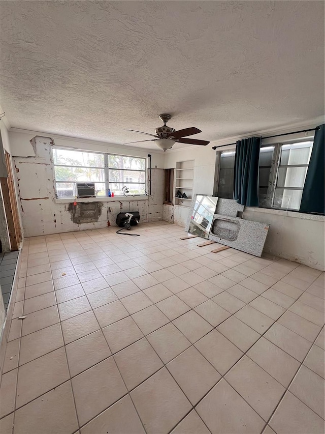 855 Boca Ciega Isle Dr, St Pete Beach, FL 33706 - living area featuring a textured ceiling, ceiling fan, cooling unit, and light tile patterned flooring