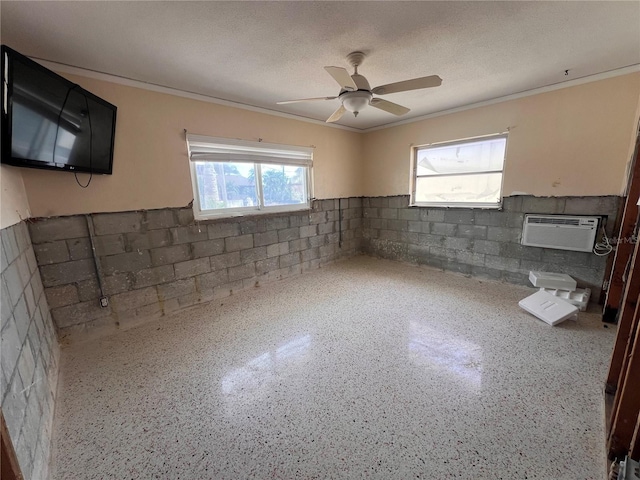 855 Boca Ciega Isle Dr, St Pete Beach, FL 33706 - interior space with crown molding, an AC wall unit, a ceiling fan, and concrete block wall