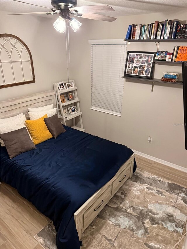 260 Teddy Rushing St, Debary, FL 32713 - bedroom with baseboards, a ceiling fan, and wood finished floors