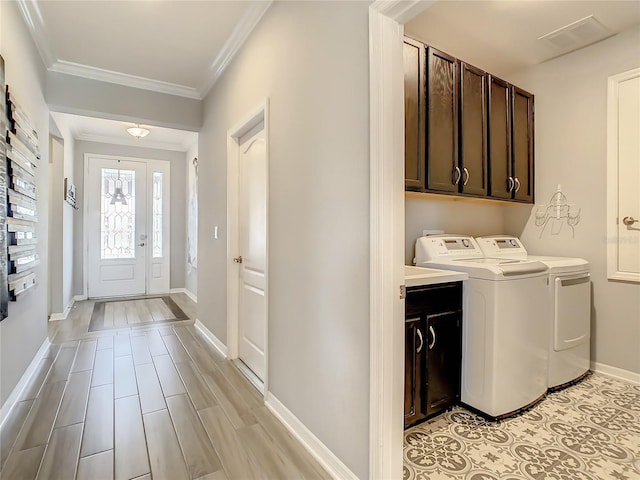 260 Teddy Rushing St, Debary, FL 32713 - laundry room featuring crown molding, visible vents, washer and dryer, baseboards, and cabinet space