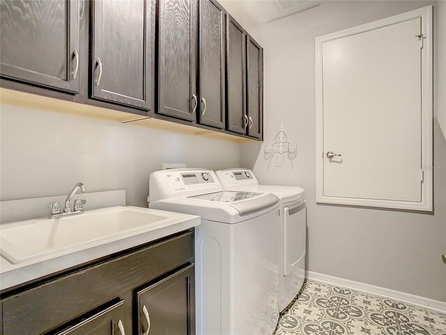 260 Teddy Rushing St, Debary, FL 32713 - laundry room with tile patterned flooring, baseboards, a sink, cabinet space, and independent washer and dryer