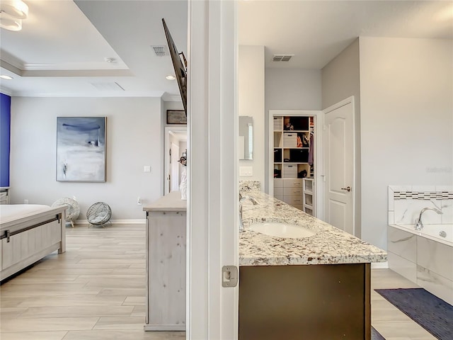 260 Teddy Rushing St, Debary, FL 32713 - interior space with a sink, light stone countertops, light wood-style flooring, and visible vents