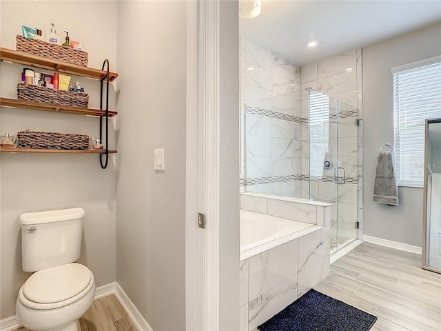 260 Teddy Rushing St, Debary, FL 32713 - full bath featuring toilet, baseboards, a garden tub, and a stall shower