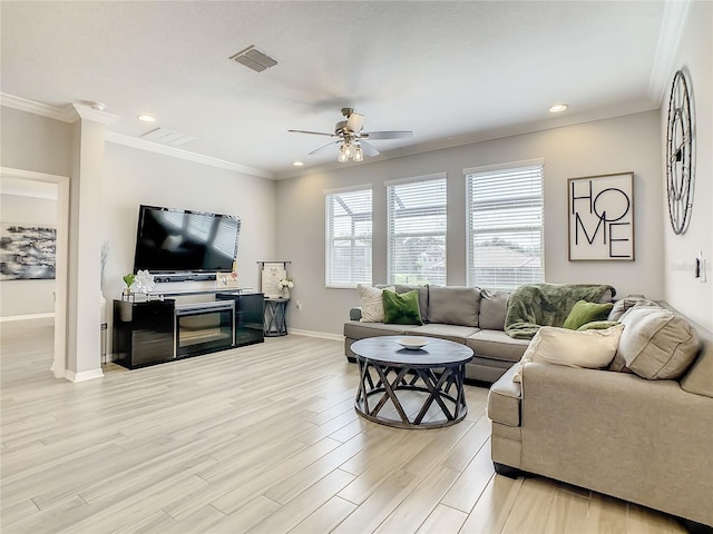 260 Teddy Rushing St, Debary, FL 32713 - living room with ceiling fan, visible vents, baseboards, ornamental molding, and light wood-style flooring