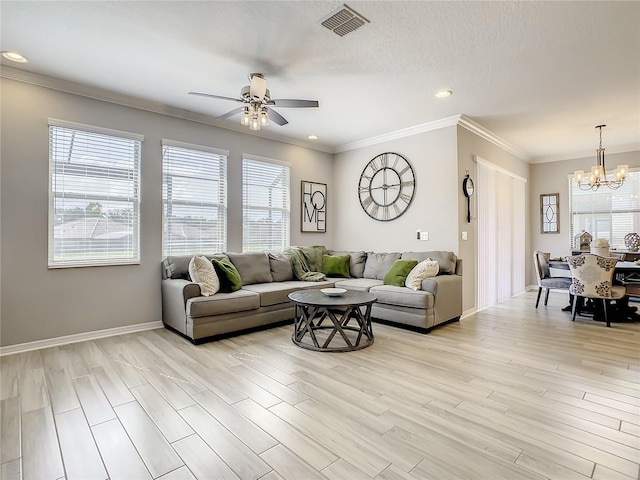 260 Teddy Rushing St, Debary, FL 32713 - living area with crown molding, light wood finished floors, ceiling fan with notable chandelier, recessed lighting, and visible vents
