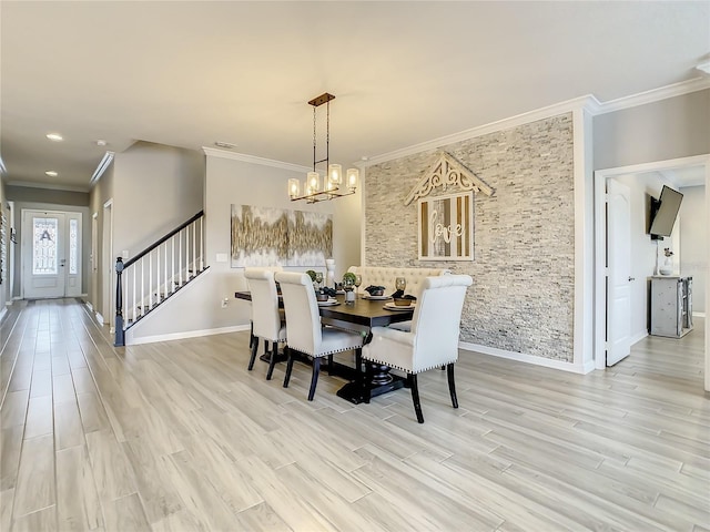 260 Teddy Rushing St, Debary, FL 32713 - dining area featuring ornamental molding, baseboards, stairway, light wood-style flooring, and a notable chandelier